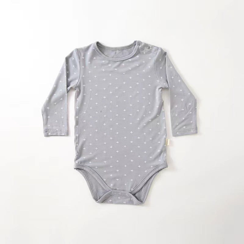 Soft cotton long sleeved onesies for babies featuring floral and heart patterns in white, pink, blue, and apricot colors.