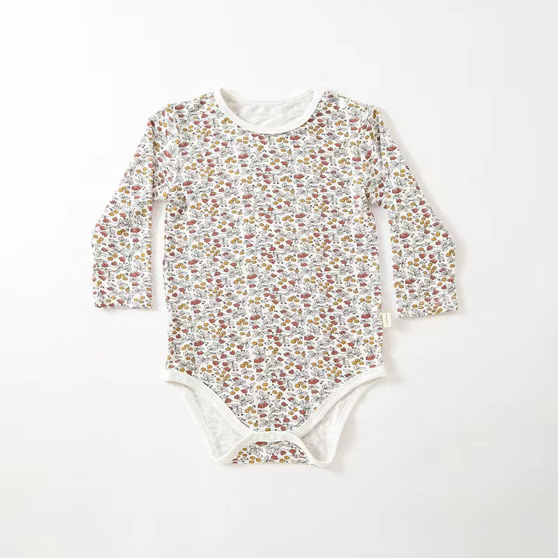 Soft cotton long sleeved onesies for babies featuring floral and heart patterns in white, pink, blue, and apricot colors.