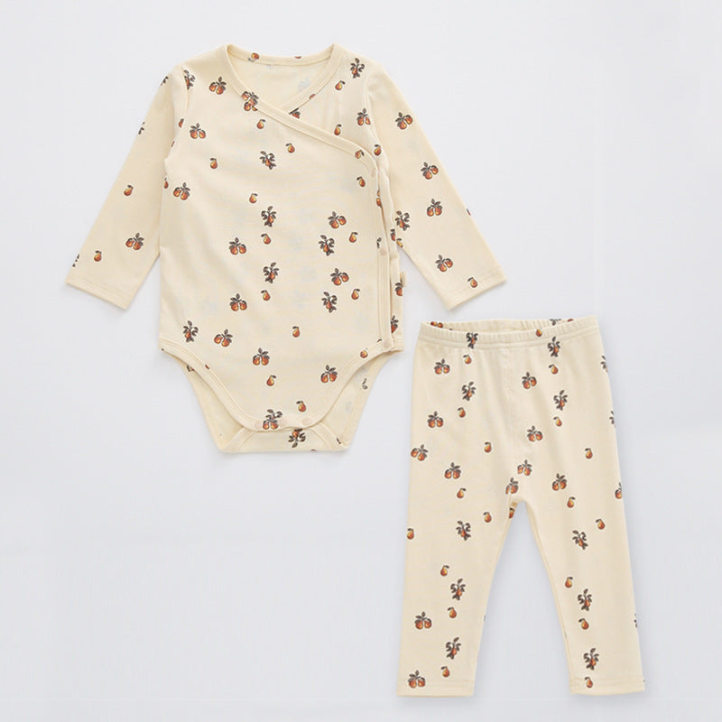 A cute baby outfit featuring a floral print pattern with a side buckle design, perfect for warm weather.