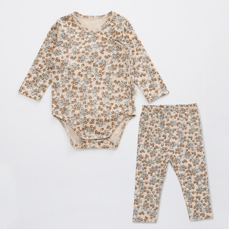 A cute baby outfit featuring a floral print pattern with a side buckle design, perfect for warm weather.