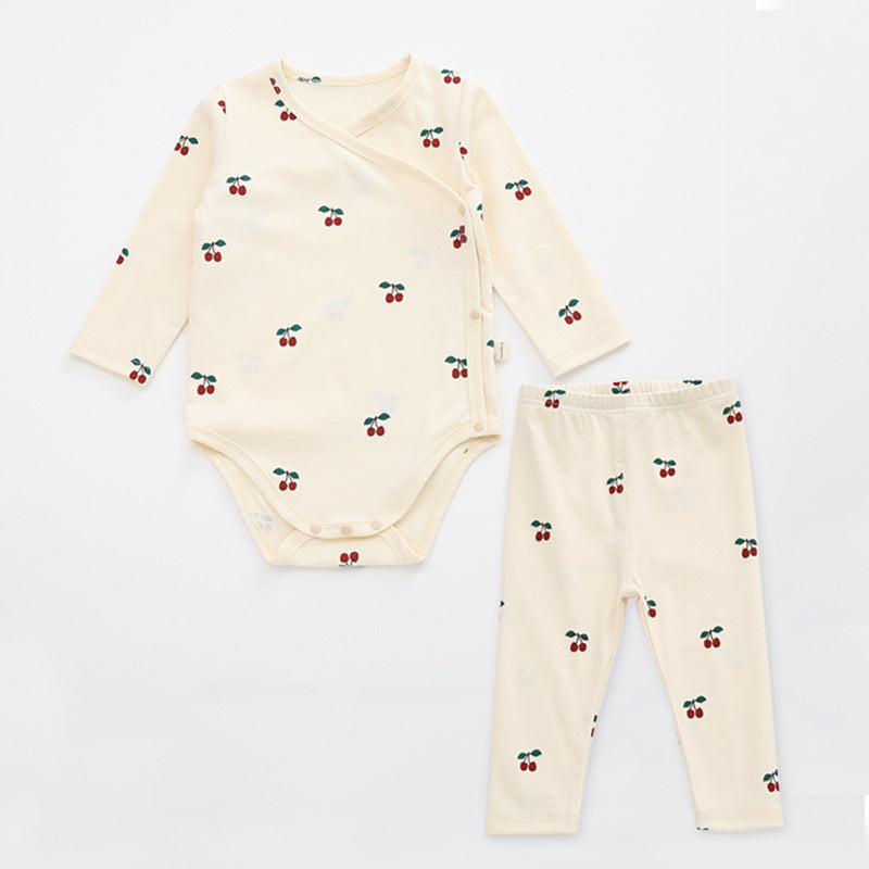 A cute baby outfit featuring a floral print pattern with a side buckle design, perfect for warm weather.
