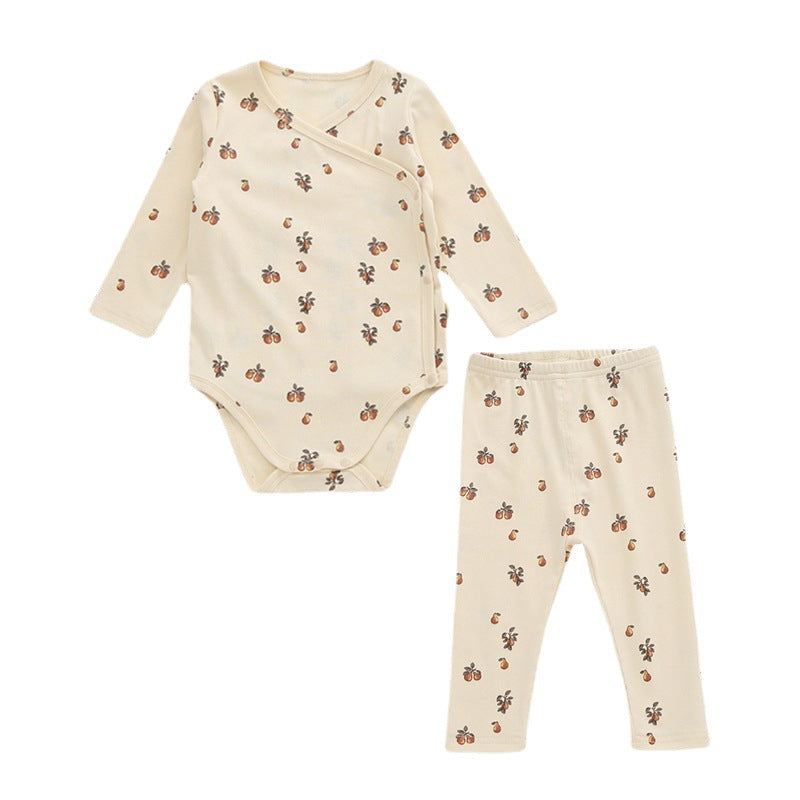 A cute baby outfit featuring a floral print pattern with a side buckle design, perfect for warm weather.