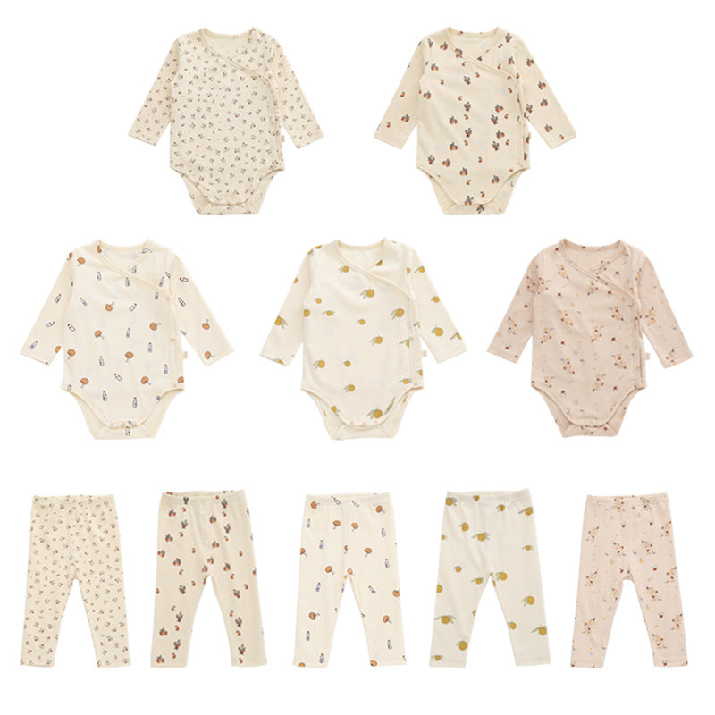 A cute baby outfit featuring a floral print pattern with a side buckle design, perfect for warm weather.