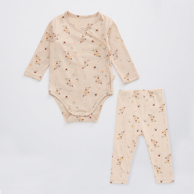 A cute baby outfit featuring a floral print pattern with a side buckle design, perfect for warm weather.