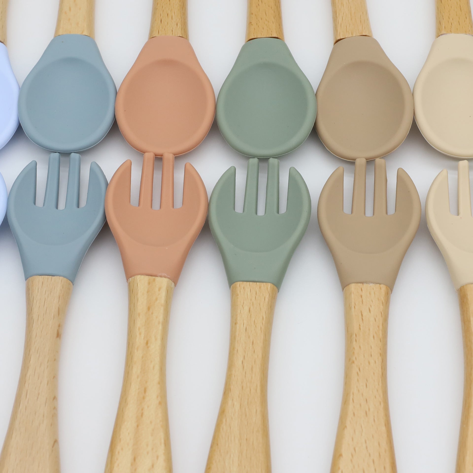 Baby Food Grade Wooden Handles Silicone Spoon Fork Cutlery set in various colors with soft silicone and wooden handles.