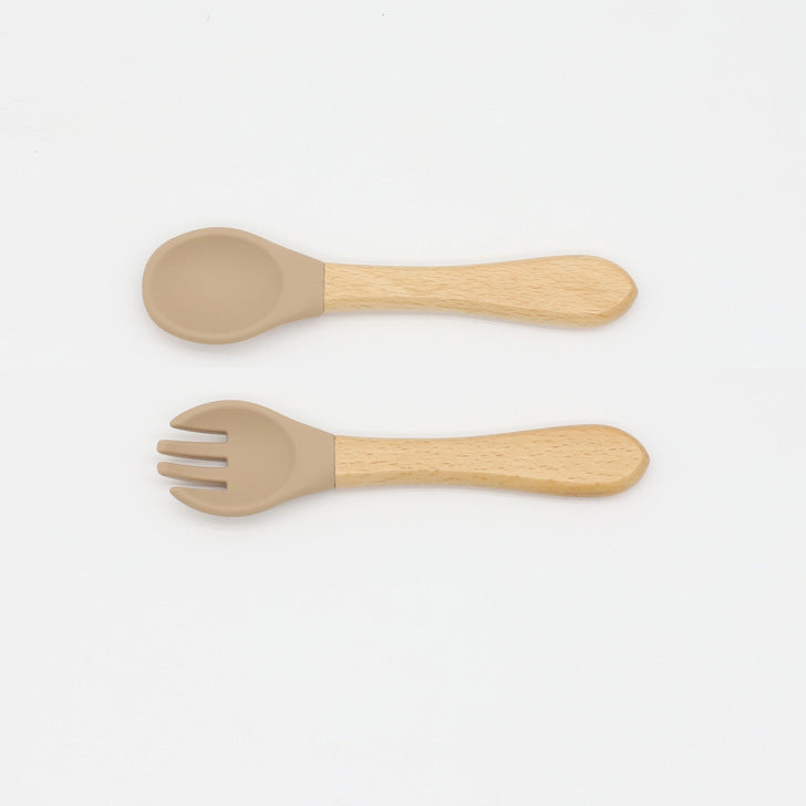 Baby Food Grade Wooden Handles Silicone Spoon Fork Cutlery set in various colors with soft silicone and wooden handles.