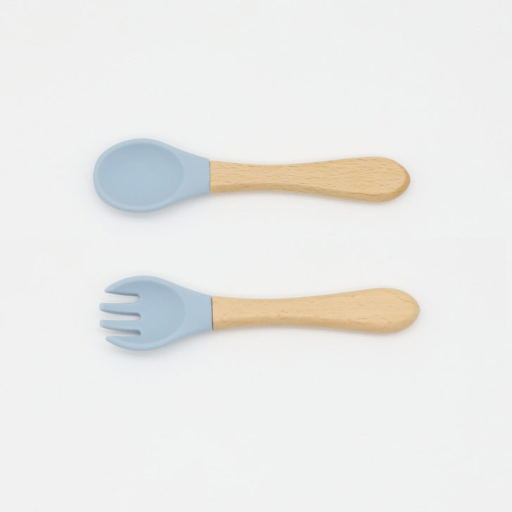 Baby Food Grade Wooden Handles Silicone Spoon Fork Cutlery set in various colors with soft silicone and wooden handles.