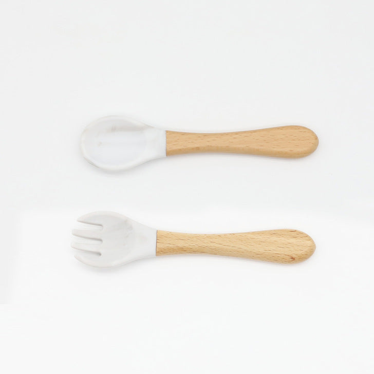 Baby Food Grade Wooden Handles Silicone Spoon Fork Cutlery set in various colors with soft silicone and wooden handles.