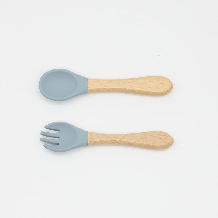 Baby Food Grade Wooden Handles Silicone Spoon Fork Cutlery set in various colors with soft silicone and wooden handles.