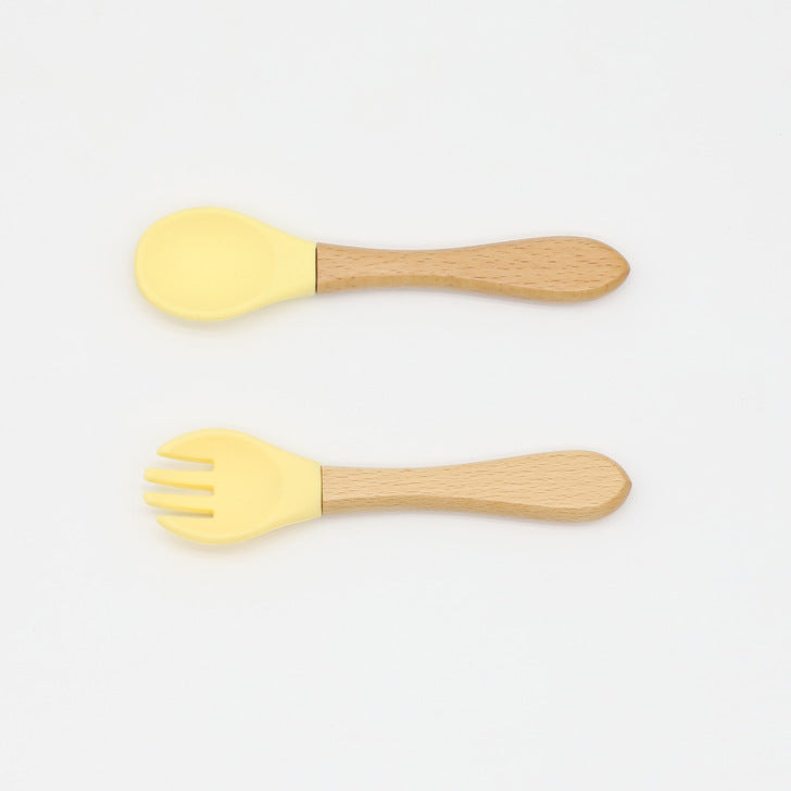 Baby Food Grade Wooden Handles Silicone Spoon Fork Cutlery set in various colors with soft silicone and wooden handles.
