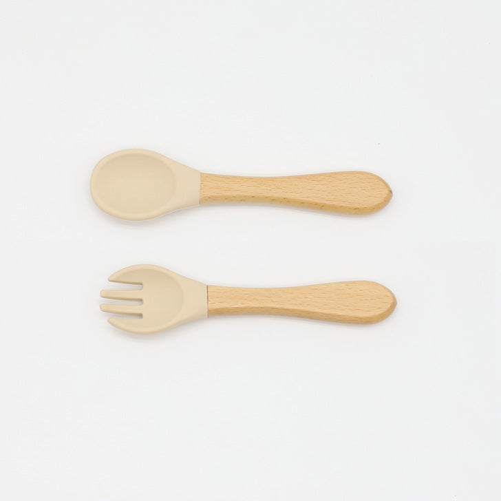 Baby Food Grade Wooden Handles Silicone Spoon Fork Cutlery set in various colors with soft silicone and wooden handles.