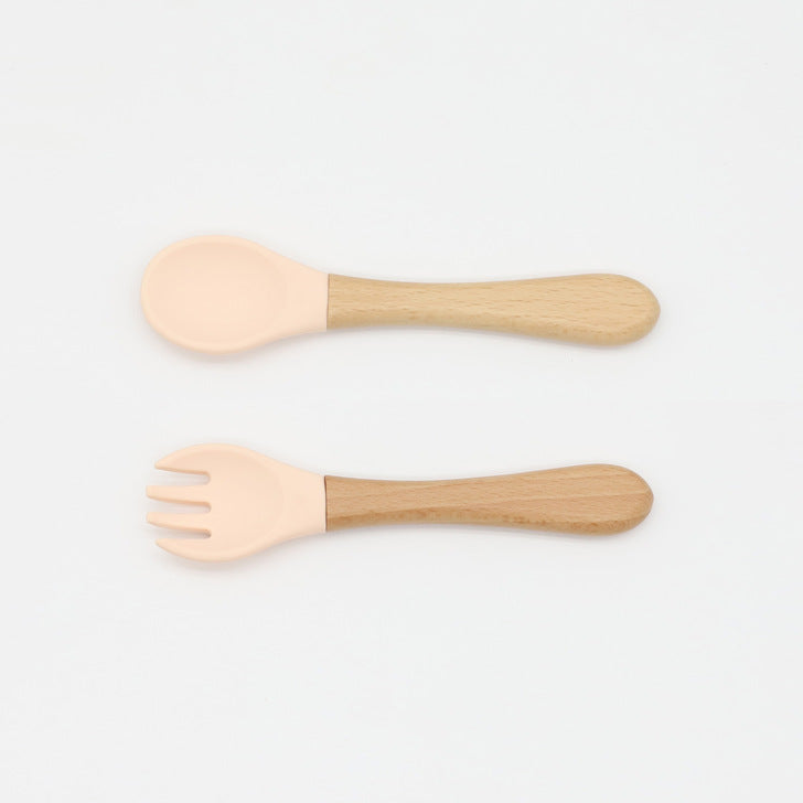 Baby Food Grade Wooden Handles Silicone Spoon Fork Cutlery set in various colors with soft silicone and wooden handles.