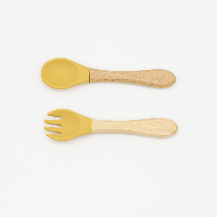 Baby Food Grade Wooden Handles Silicone Spoon Fork Cutlery set in various colors with soft silicone and wooden handles.