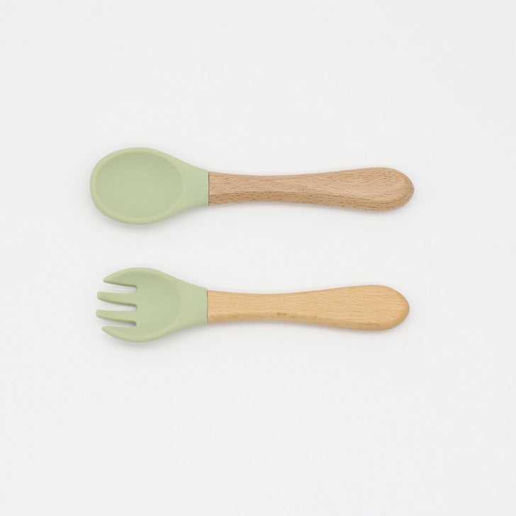Baby Food Grade Wooden Handles Silicone Spoon Fork Cutlery set in various colors with soft silicone and wooden handles.