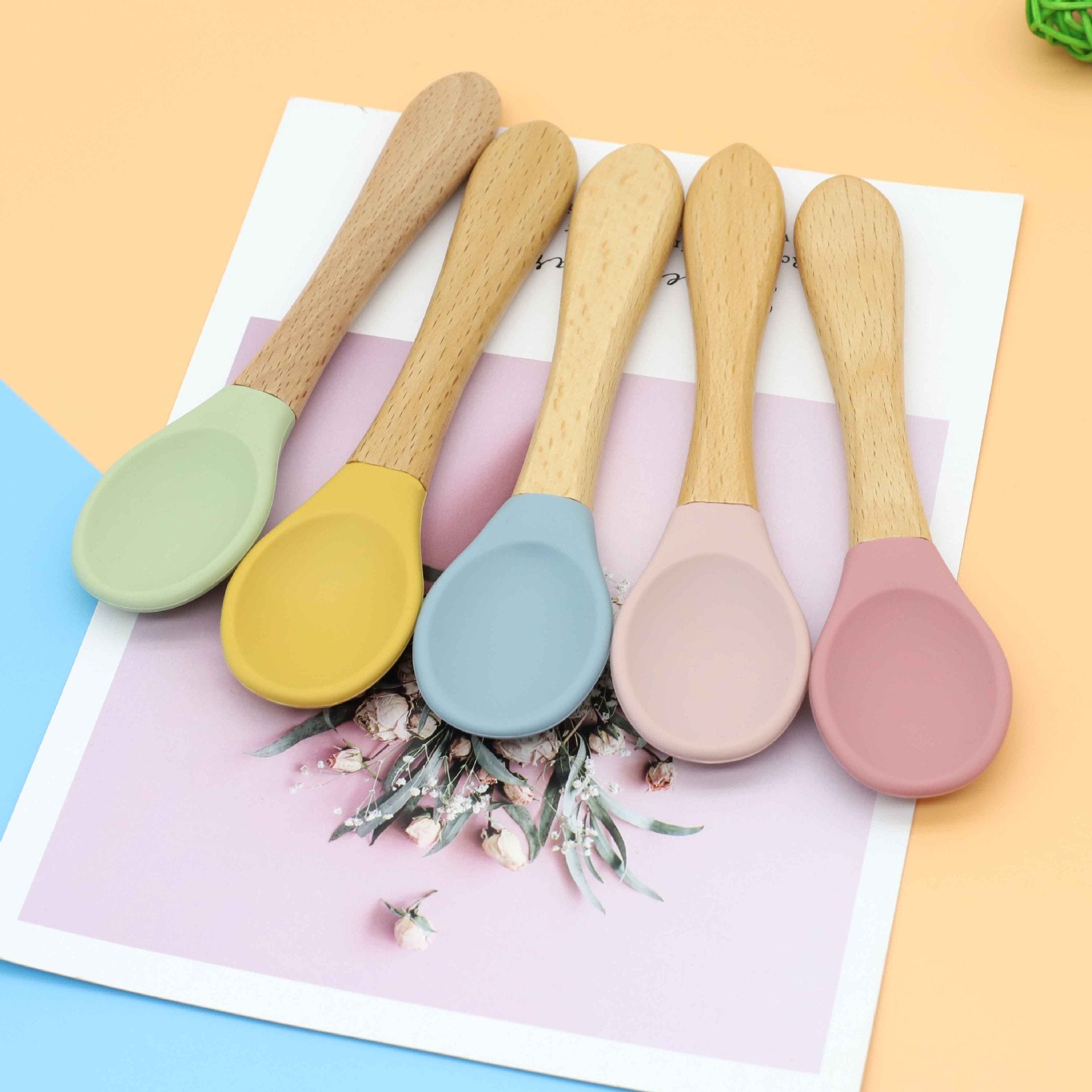 Baby Food Grade Wooden Handles Silicone Spoon Fork Cutlery set in various colors with soft silicone and wooden handles.