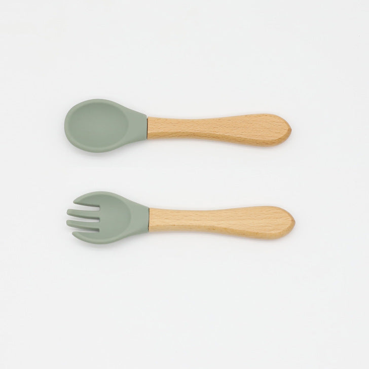 Baby Food Grade Wooden Handles Silicone Spoon Fork Cutlery set in various colors with soft silicone and wooden handles.