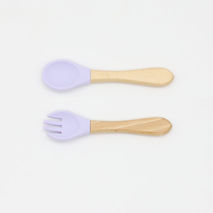 Baby Food Grade Wooden Handles Silicone Spoon Fork Cutlery set in various colors with soft silicone and wooden handles.