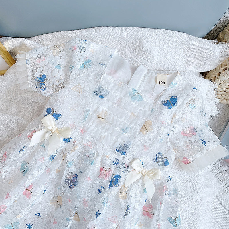 A beautiful baby girl dress featuring a butterfly print and lace patchwork design with a square collar, perfect for summer occasions.