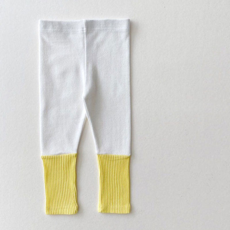 Baby girl candy color patchwork design tight bottom pants in pink, purple, green, and yellow, made from soft cotton material.