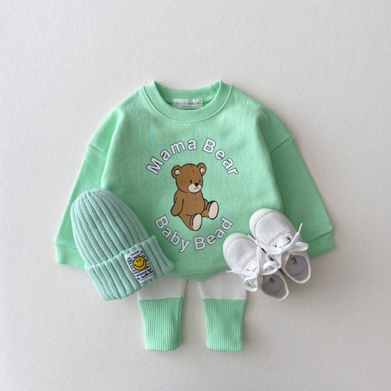 Baby girl candy color patchwork design tight bottom pants in pink, purple, green, and yellow, made from soft cotton material.