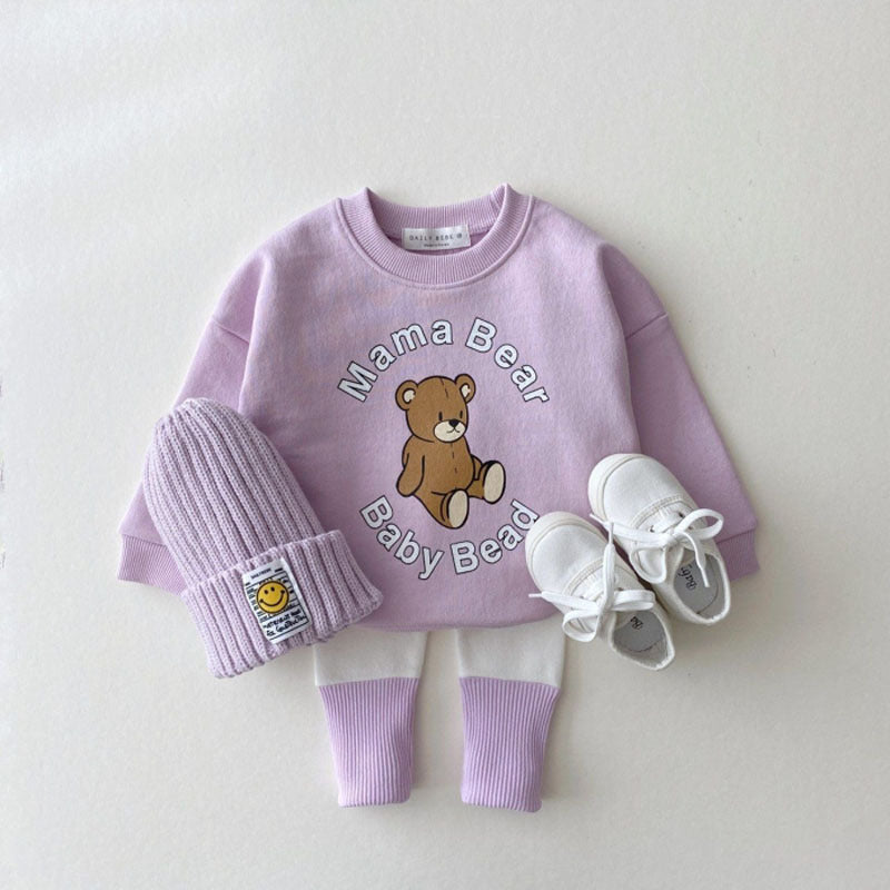 Baby girl candy color patchwork design tight bottom pants in pink, purple, green, and yellow, made from soft cotton material.