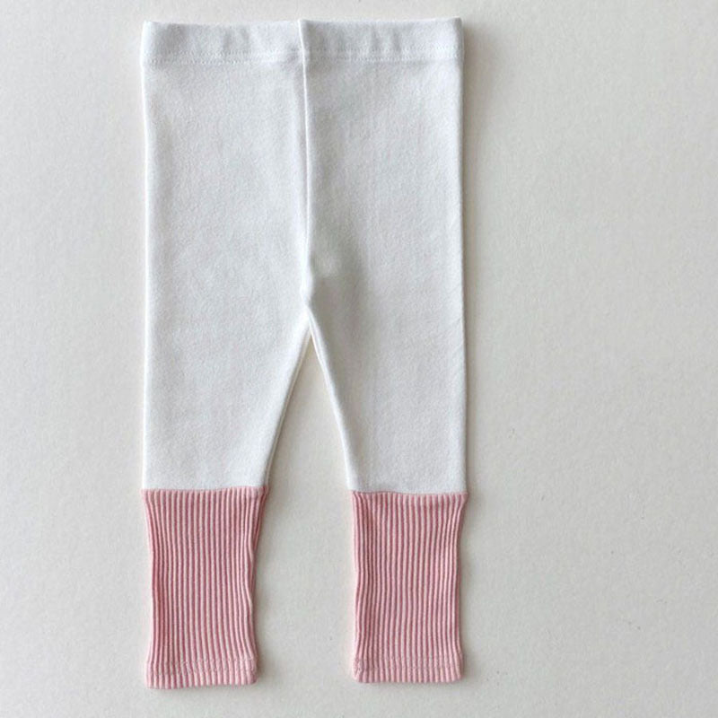 Baby girl candy color patchwork design tight bottom pants in pink, purple, green, and yellow, made from soft cotton material.