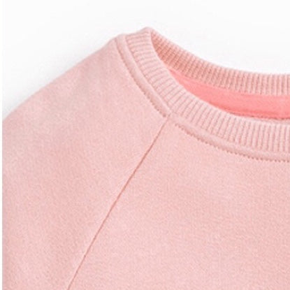 Baby girl wearing a pink cartoon animal knitted hoodie, showcasing a cozy and stylish design perfect for autumn.