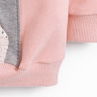 Baby girl wearing a pink cartoon animal knitted hoodie, showcasing a cozy and stylish design perfect for autumn.