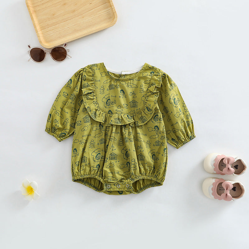 Baby girl wearing a soft cotton bodysuit with a cartoon pattern in green and apricot colors.