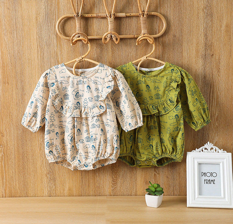 Baby girl wearing a soft cotton bodysuit with a cartoon pattern in green and apricot colors.