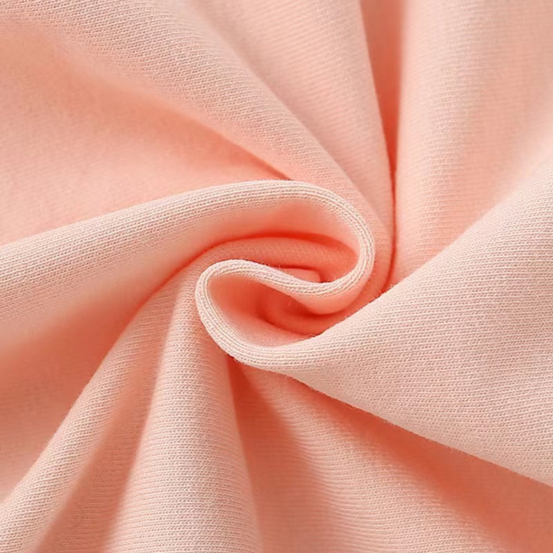 Baby girl wearing a pink cartoon print pullover hoodie with a round neck, featuring playful animal designs.