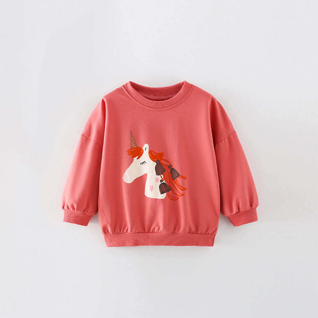 Baby girl wearing a cozy orange terry hoodie with a unicorn cartoon print, perfect for spring and autumn.