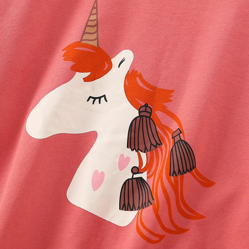 Baby girl wearing a cozy orange terry hoodie with a unicorn cartoon print, perfect for spring and autumn.