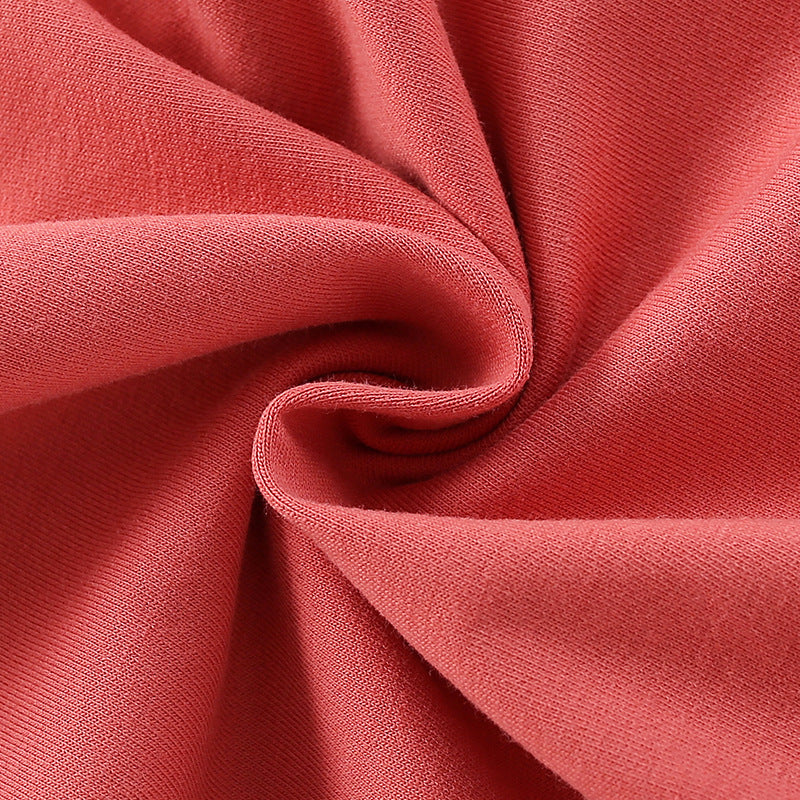 Baby girl wearing a cozy orange terry hoodie with a unicorn cartoon print, perfect for spring and autumn.