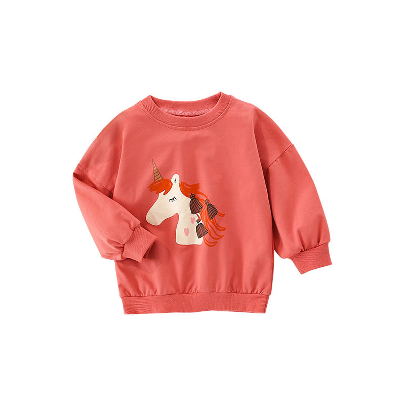 Baby girl wearing a cozy orange terry hoodie with a unicorn cartoon print, perfect for spring and autumn.