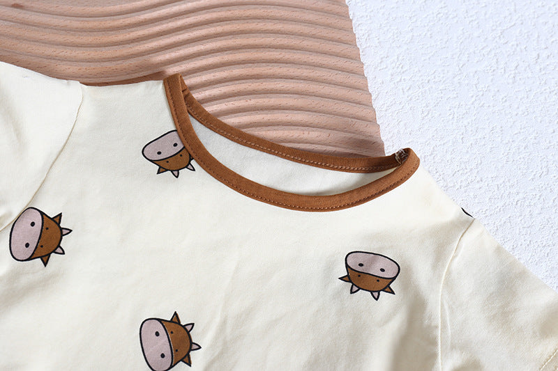 Baby girl wearing a cute cartoon sheep onesie with a round collar and a matching hat, perfect for summer.