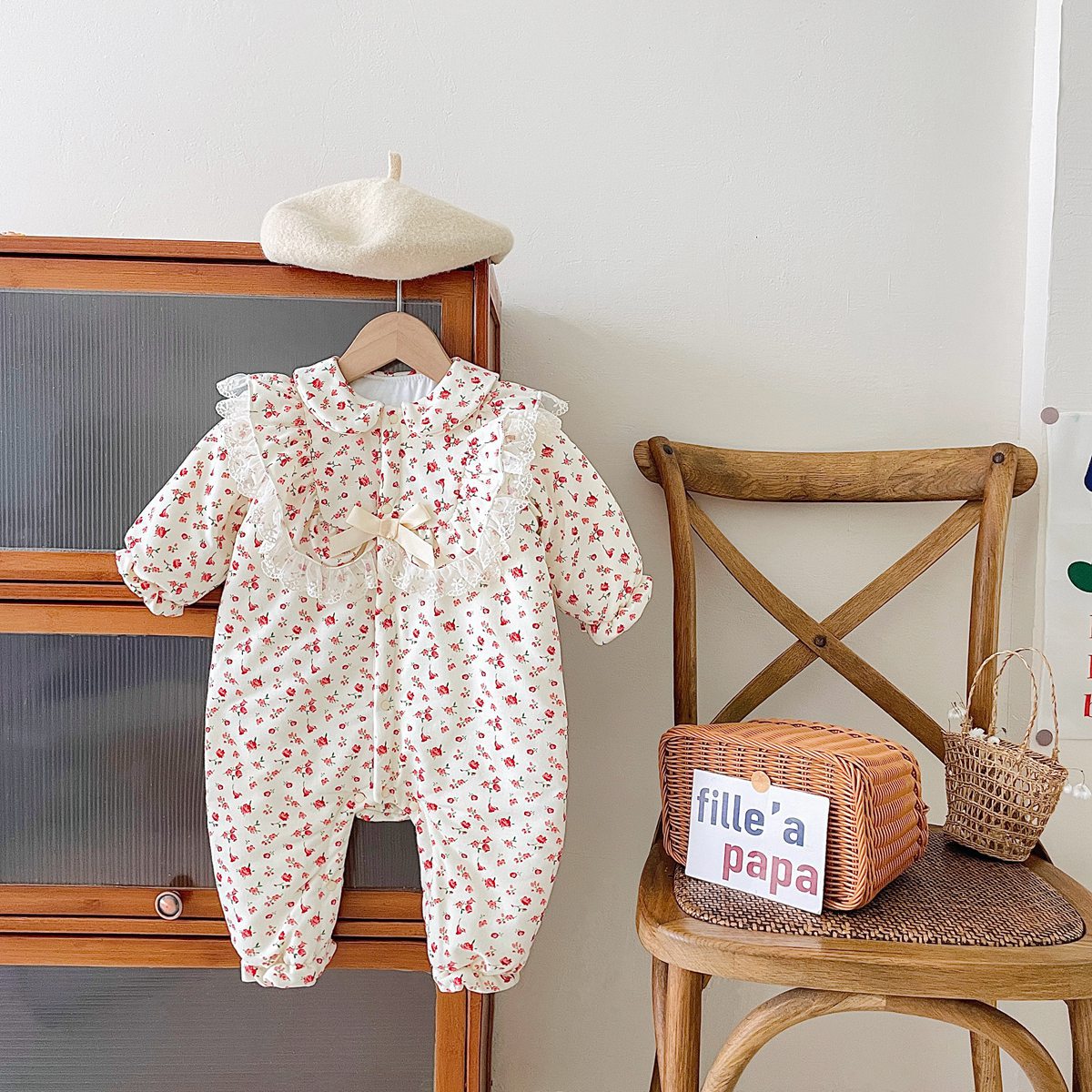 Baby girl romper featuring a ditsy flower pattern and mesh patches, designed for comfort and style.