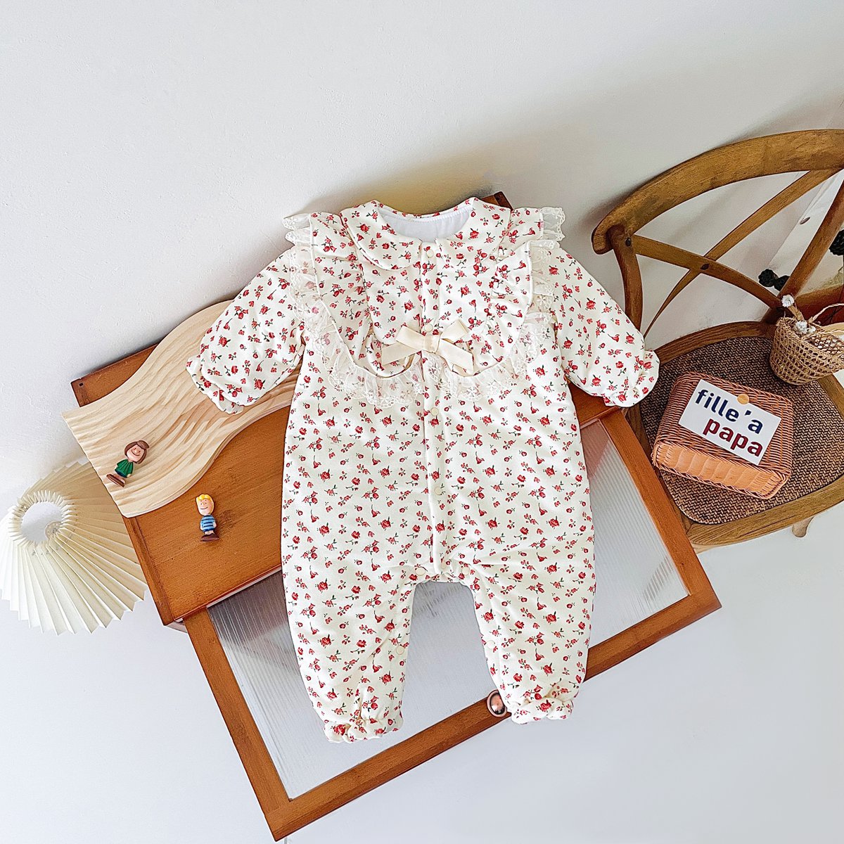 Baby girl romper featuring a ditsy flower pattern and mesh patches, designed for comfort and style.