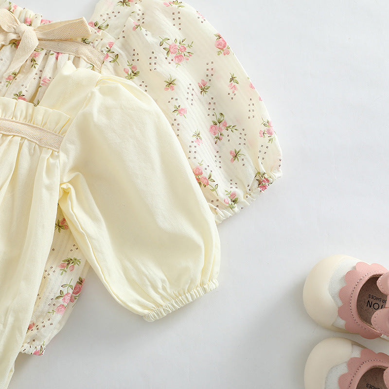 Baby girl long sleeve bodysuit featuring a ditsy flower pattern and solid colors in pink and beige, made from soft cotton fabric.