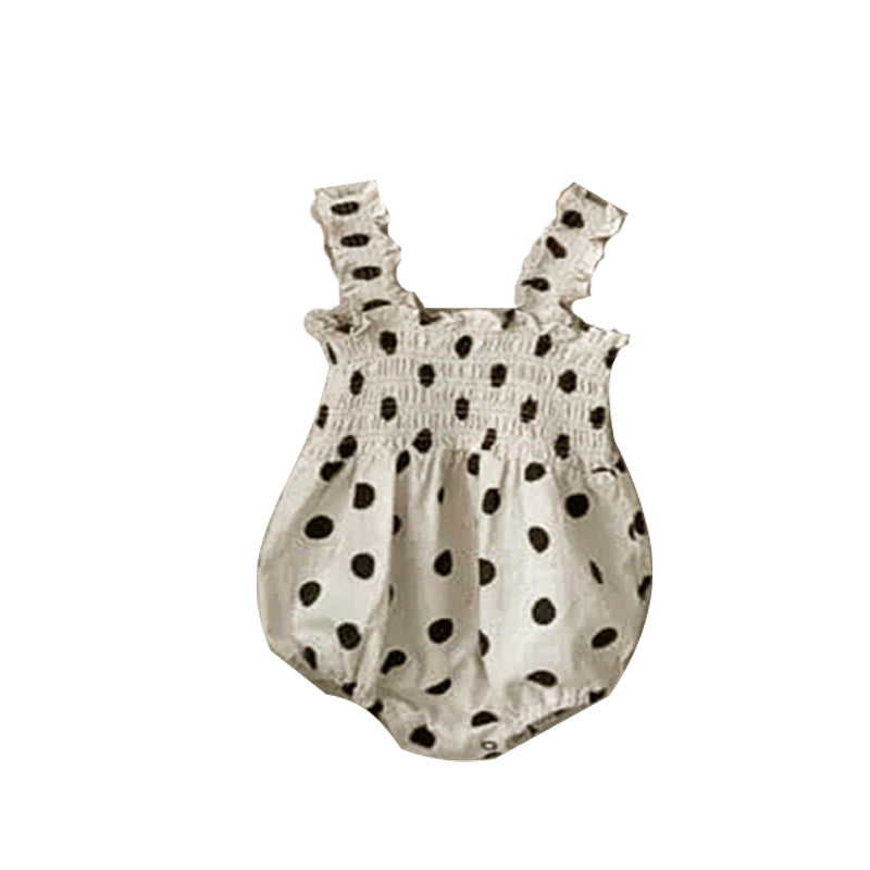 Baby girl wearing a beige and apricot polka dot sling onesie and dress, perfect for summer outings.
