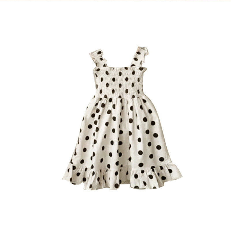 Baby girl wearing a beige and apricot polka dot sling onesie and dress, perfect for summer outings.
