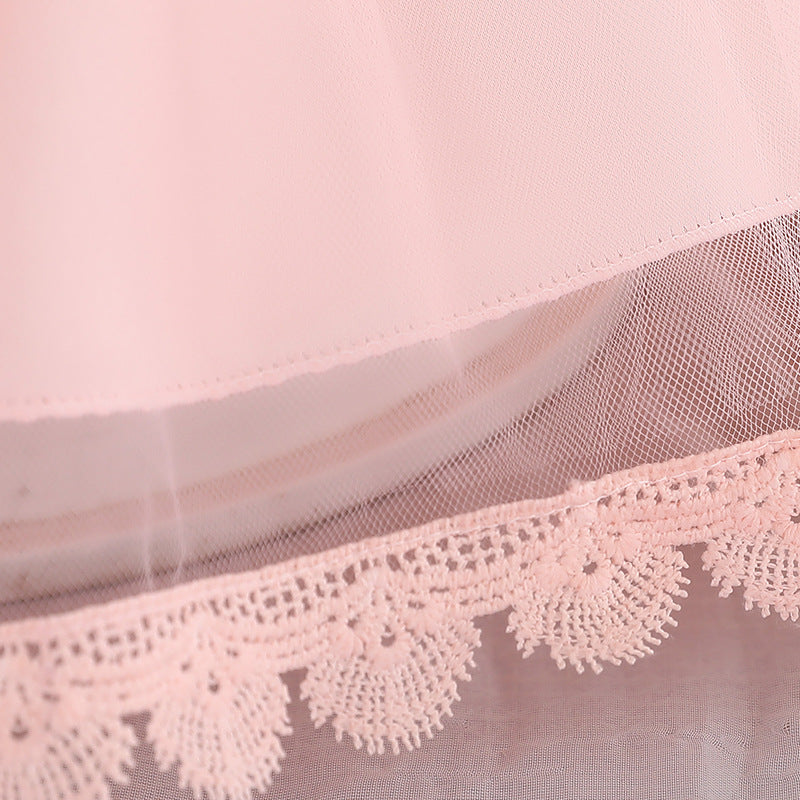 Baby girl wearing a floral embroidered christening dress with sequins and a tutu style, showcasing elegance and charm.