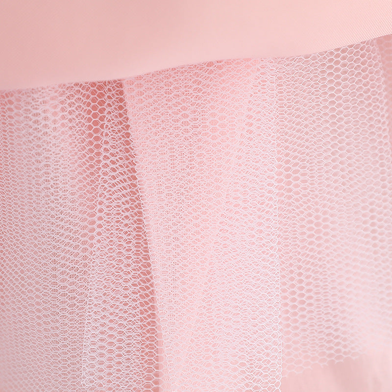 Baby girl wearing a floral embroidered christening dress with sequins and a tutu style, showcasing elegance and charm.