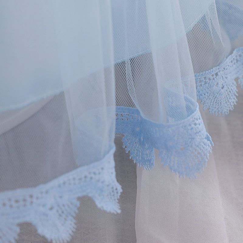 Baby girl wearing a floral embroidered christening dress with sequins and a tutu style, showcasing elegance and charm.