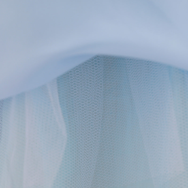 Baby girl wearing a floral embroidered christening dress with sequins and a tutu style, showcasing elegance and charm.