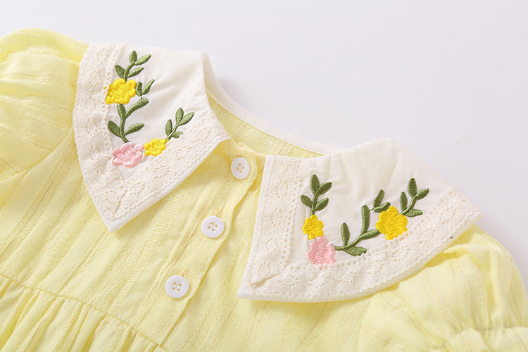 Baby girl onesie featuring floral embroidery design in pink, yellow, and beige colors, perfect for summer wear.