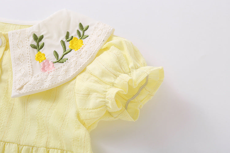 Baby girl onesie featuring floral embroidery design in pink, yellow, and beige colors, perfect for summer wear.