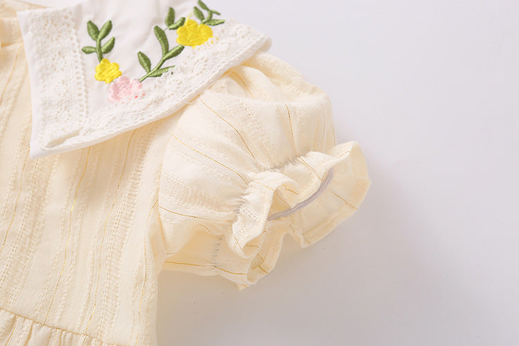 Baby girl onesie featuring floral embroidery design in pink, yellow, and beige colors, perfect for summer wear.