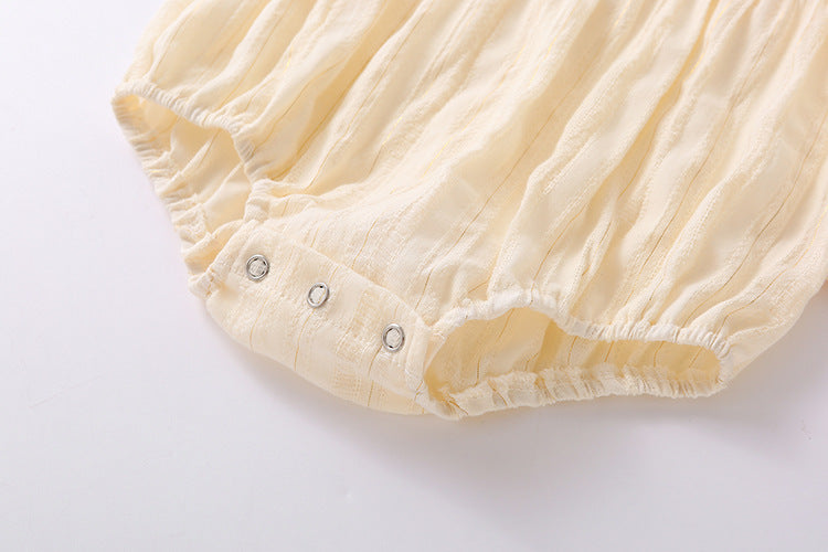 Baby girl onesie featuring floral embroidery design in pink, yellow, and beige colors, perfect for summer wear.