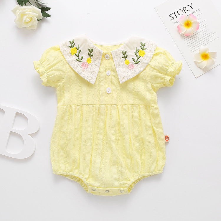 Baby girl onesie featuring floral embroidery design in pink, yellow, and beige colors, perfect for summer wear.